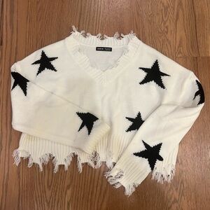 RIPPED STAR SWEATER
